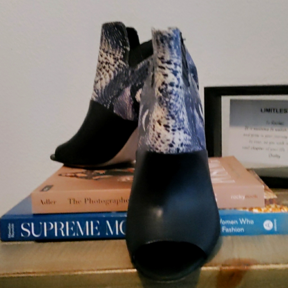 Calvin Klein black and snake skin ankle boots